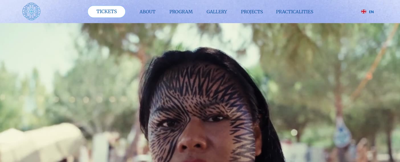 After: a full-screen video of a festival guest, with the tickets button